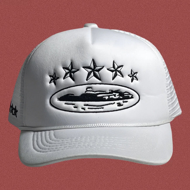 Corteiz Vintage White Trucker Hat with Black Stars and Cruise Ship Graphic Hover Image