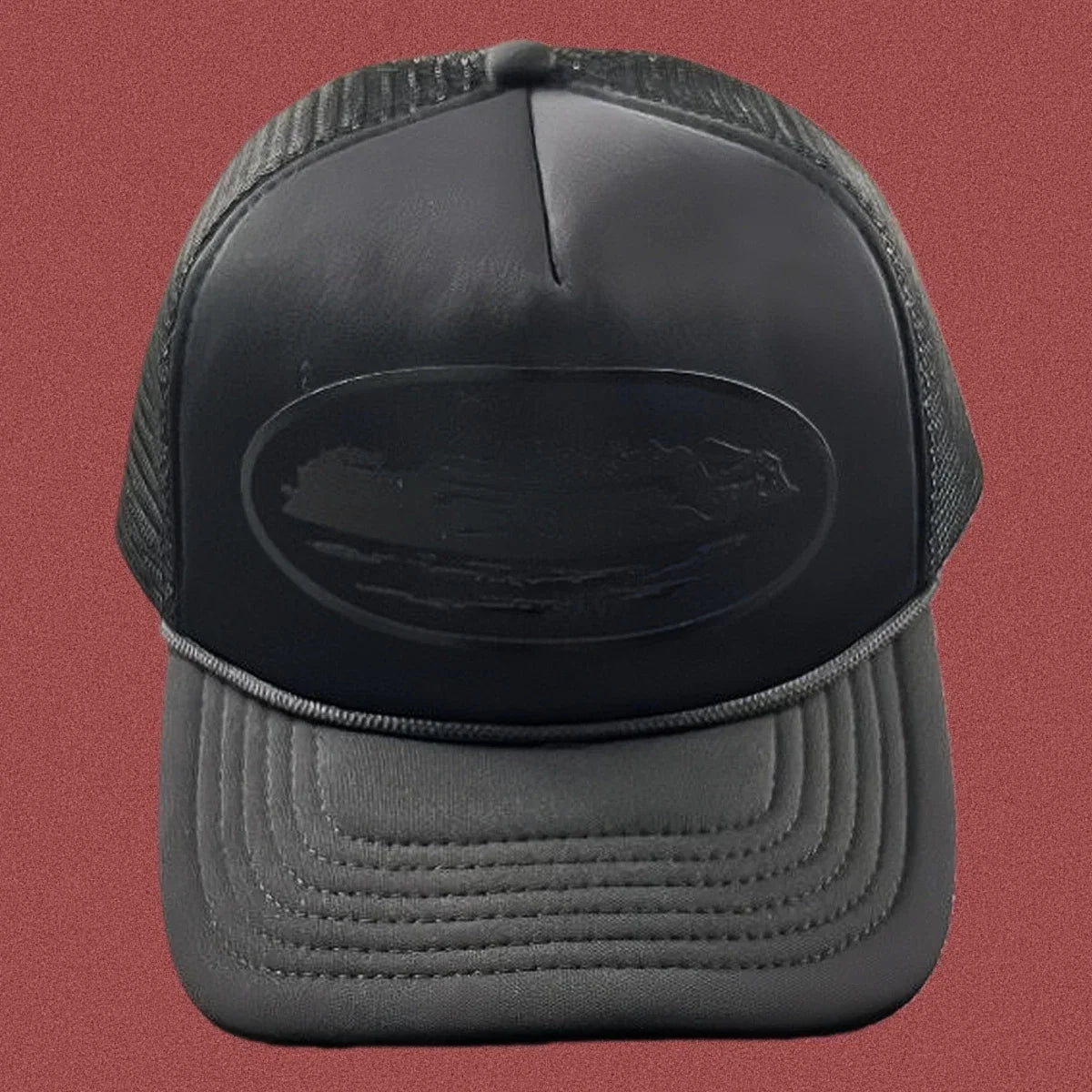 Corteiz All-Black Monochromatic Oval Ship Logo Trucker Hat