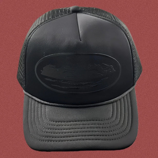 Corteiz All-Black Monochromatic Oval Ship Logo Trucker Hat Hover Image